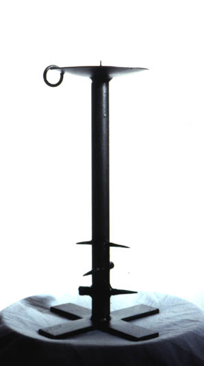 Spiked and pierced candle stick